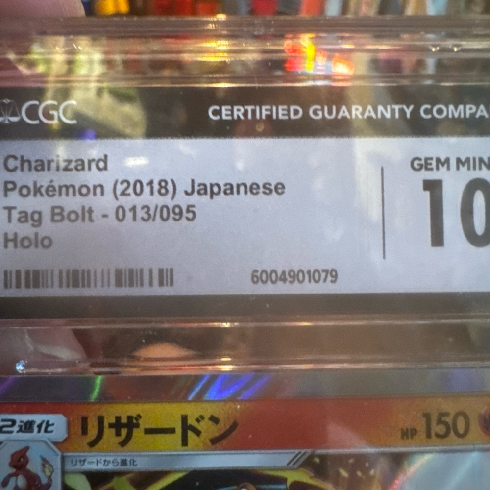 Pokemon Card with Blue and Yellow Design Charizard